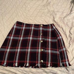 plaid mini skirt w buttons on the front